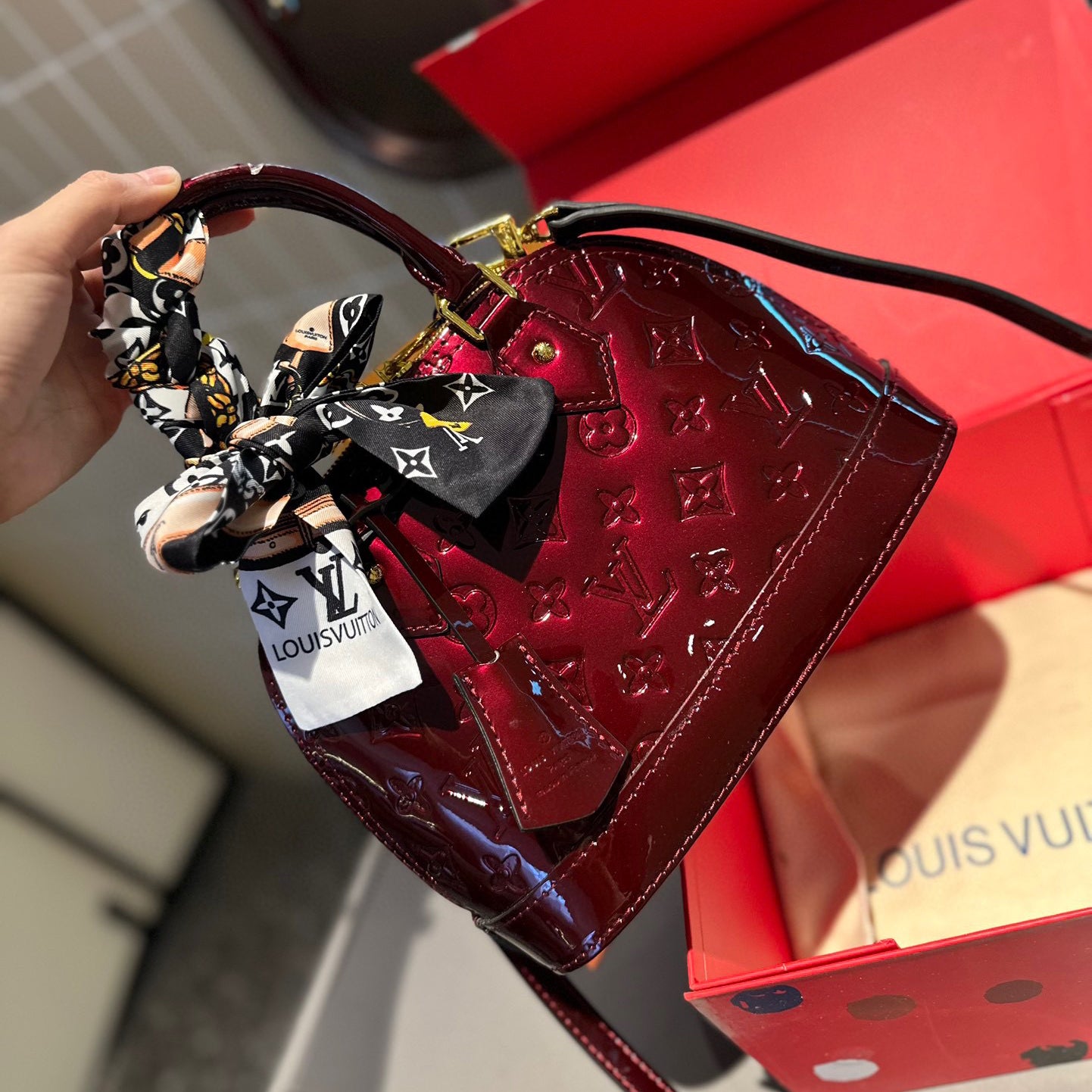 Embossed bright leather Alma shell bag 1824041702